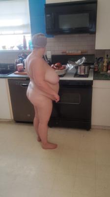 Belly Goddess Showing her Huge Belly in the Kitchen