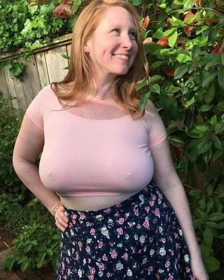 Thick and busty redhead