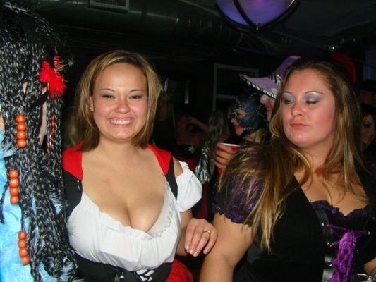 Cute curvy brunette shows cleavage on Halloween