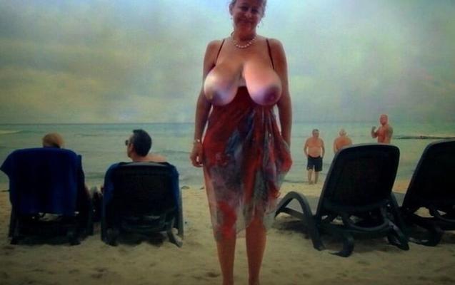 Big Tits strips outdoors